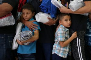 Undocumented immigrant families are released from detention at a bus depot in McAllen