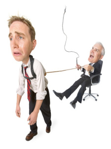 conceptual caricature of caucasian businessman in suit he whips employee pulling him around in chair